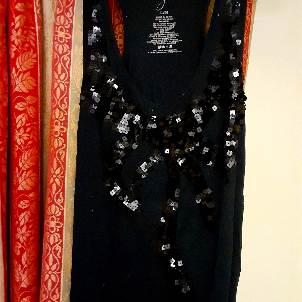 Variety of ladies shirts and skirts.